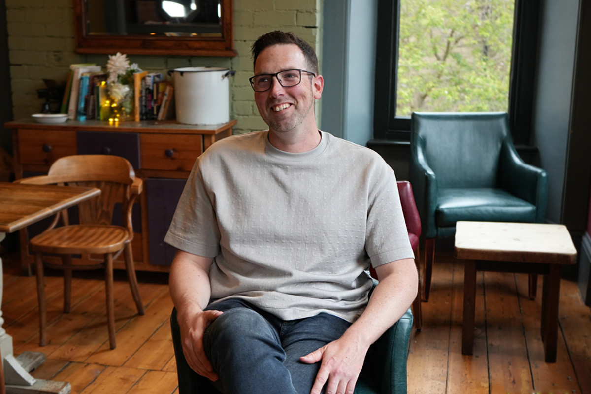 Andy life coach headshot sat in a chair